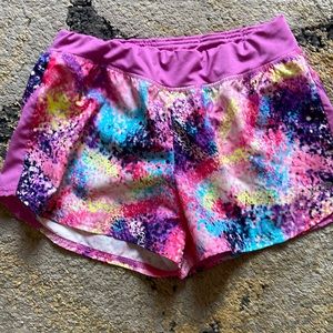 Champion multi colored running shorts with built in underwear.  Size 14/16